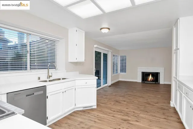 a kitchen with a sink and a window