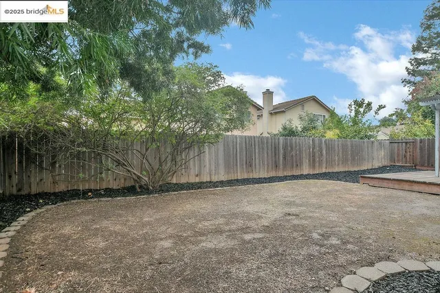 an aerial view of a house with plants and outdoor seating