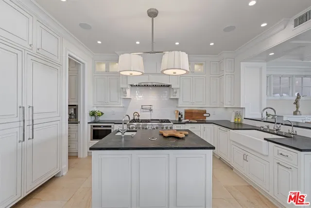 a living room with furniture large window and fireplace