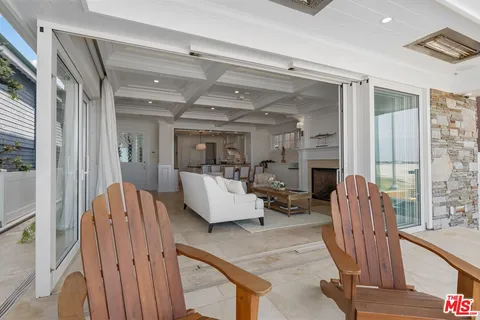 a view of a two chairs and table in balcony