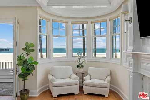 a spacious bedroom with a bed and a fireplace