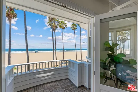 a view of balcony with a yard