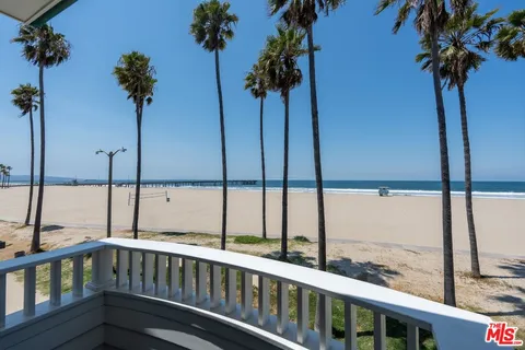 a bathroom with a double vanity sink toilet mirror and bathtub