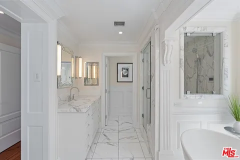 a living room with furniture and a painting