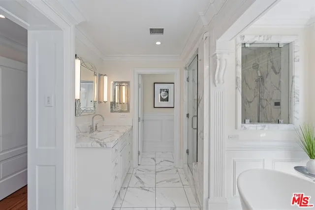 a living room with furniture and a painting