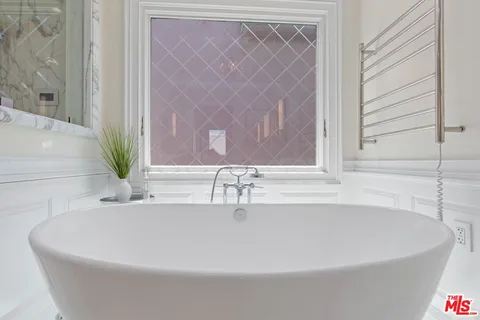 a living room with furniture and a stairs