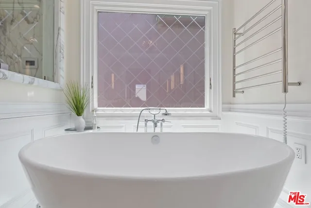 a living room with furniture and a stairs
