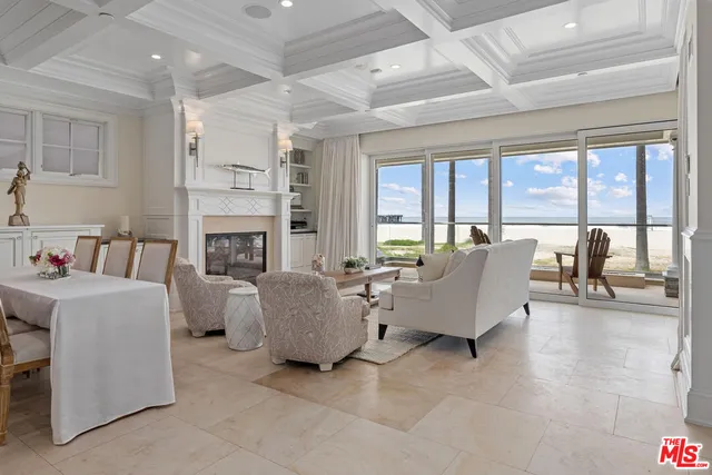 a living room with furniture and fireplace