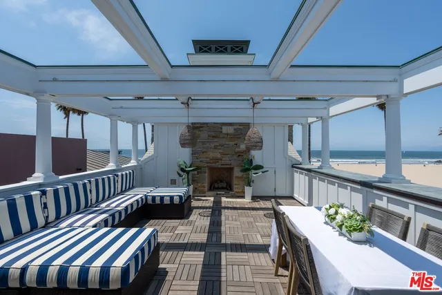 a view of a patio with a table and chairs