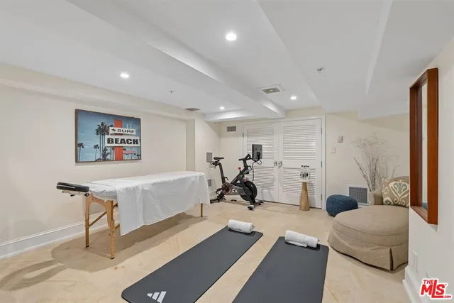 a bathroom with double sink and a mirror
