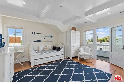 a view of a storage and utility room with washer and dryer