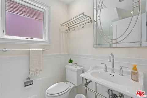 a front view of a house with garden and porch