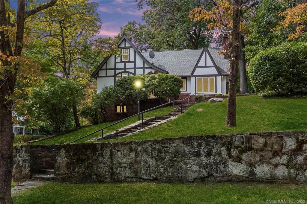 86 Valleywood Road Greenwich, CT 06807 - Photo 1 of 1 a view of a house with a yard and potted plants