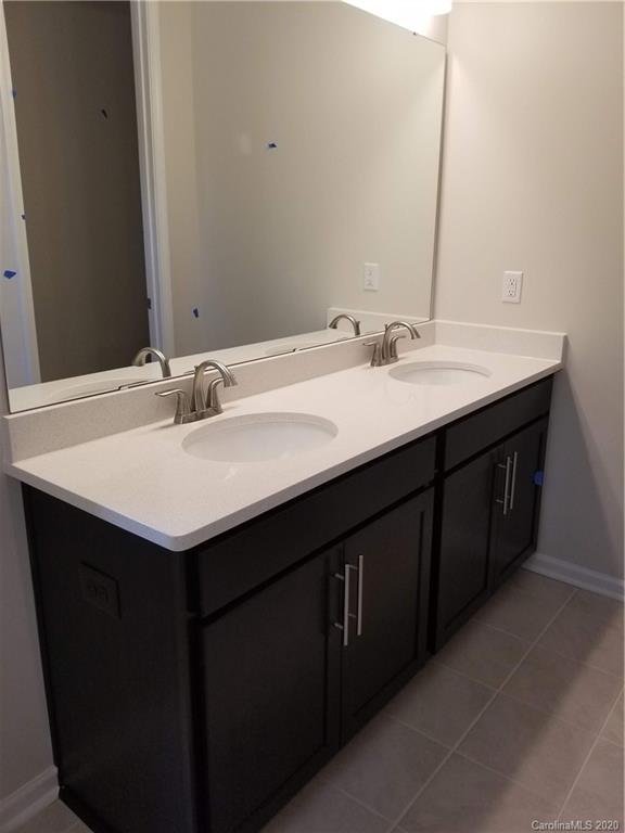 514 Madison Falls, Unit 7 Fort Mill, SC 29708 - Photo 8 of 12 a bathroom with a sink and a mirror