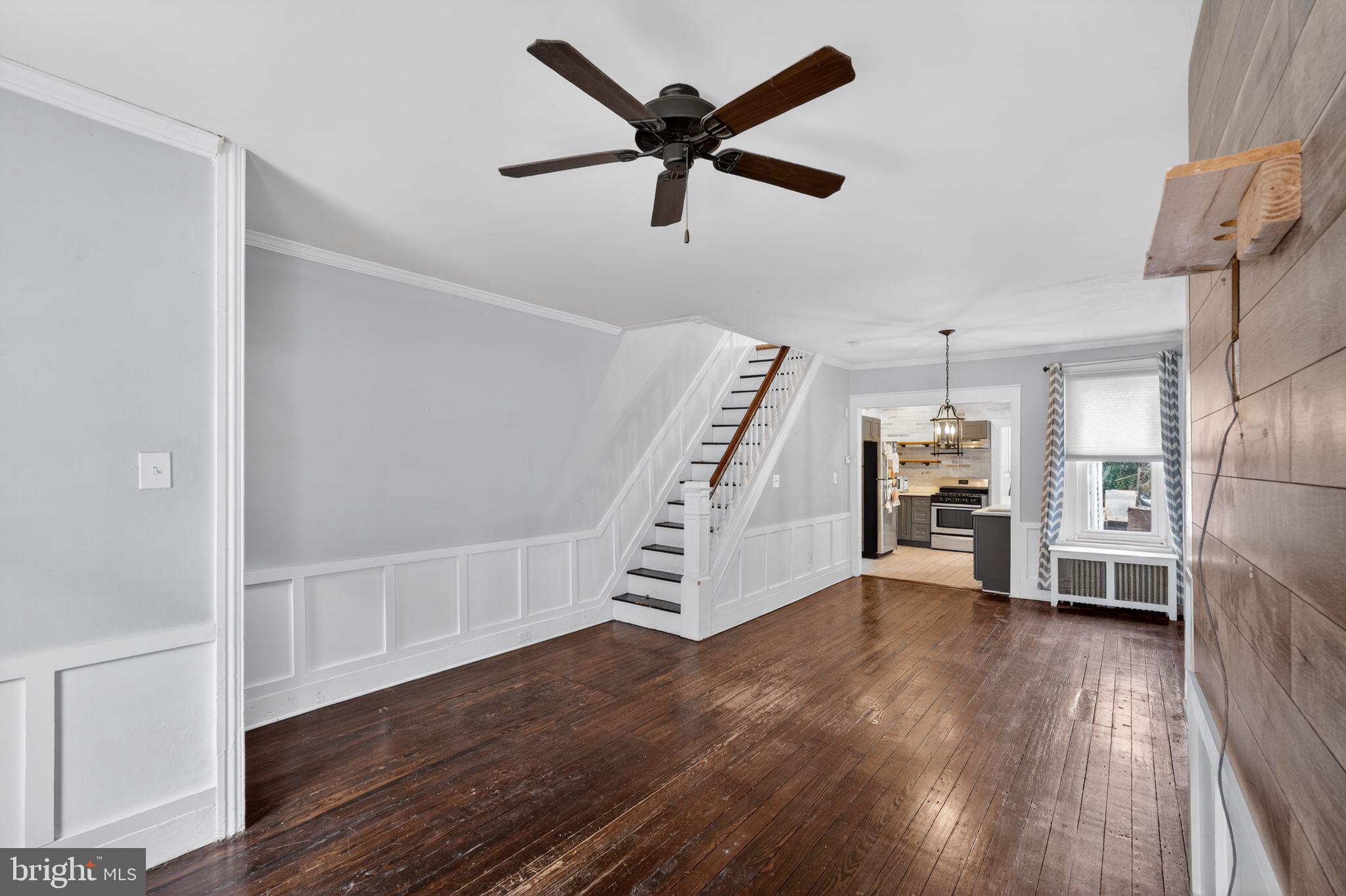 137 Davis Street Philadelphia, PA 19127 - Photo 2 of 17 a view of a livingroom with a hardwood floor and a ceiling fan