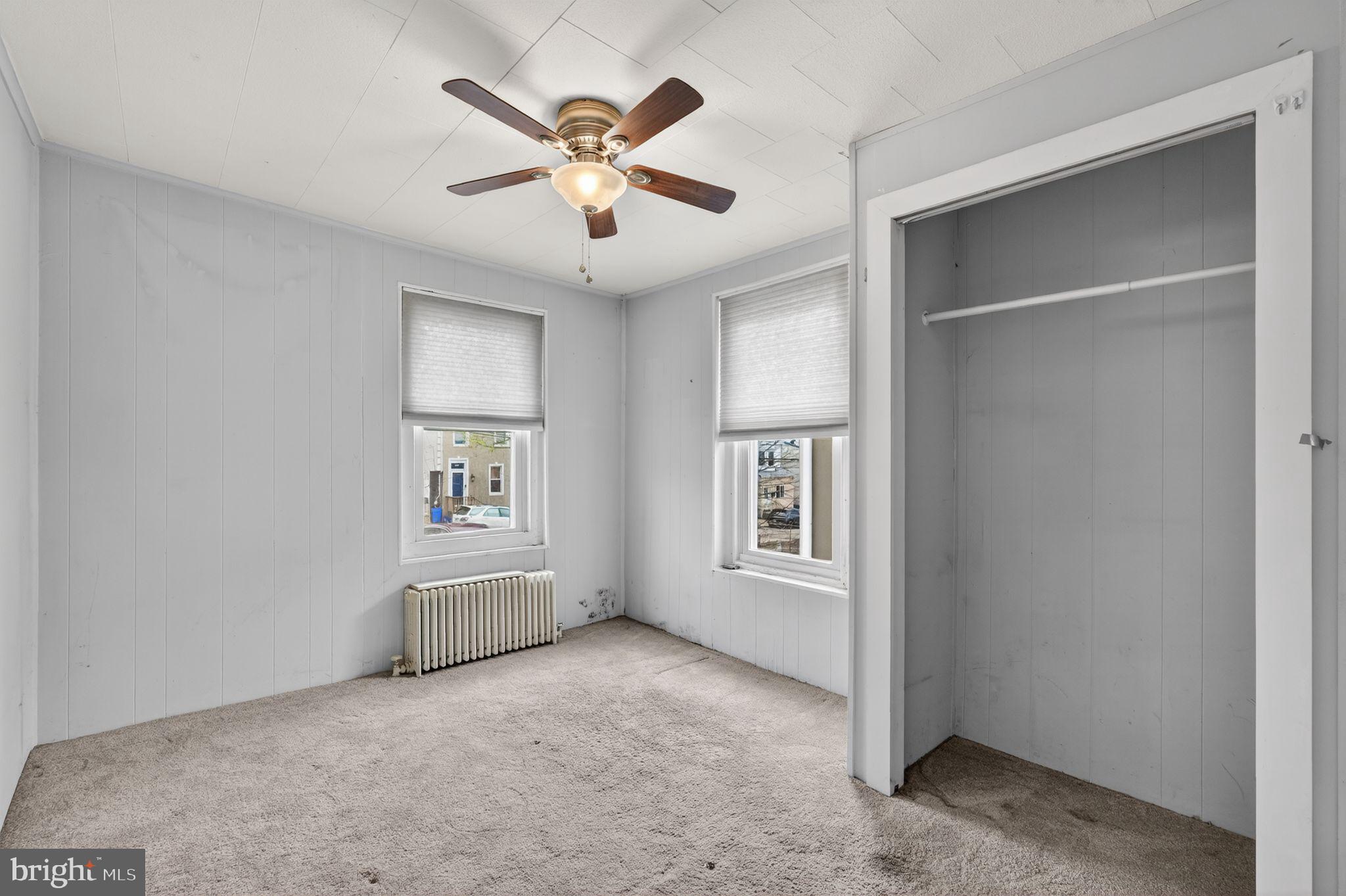 137 Davis Street Philadelphia, PA 19127 - Photo 8 of 17 an empty room with windows and fan