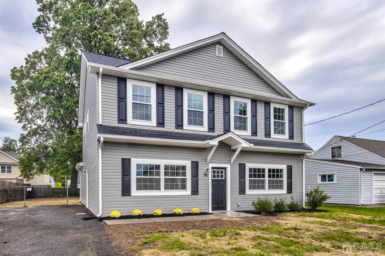 84 Ashley Road Edison, NJ 08817 - Photo 1 of 27 a front view of a house with a yard