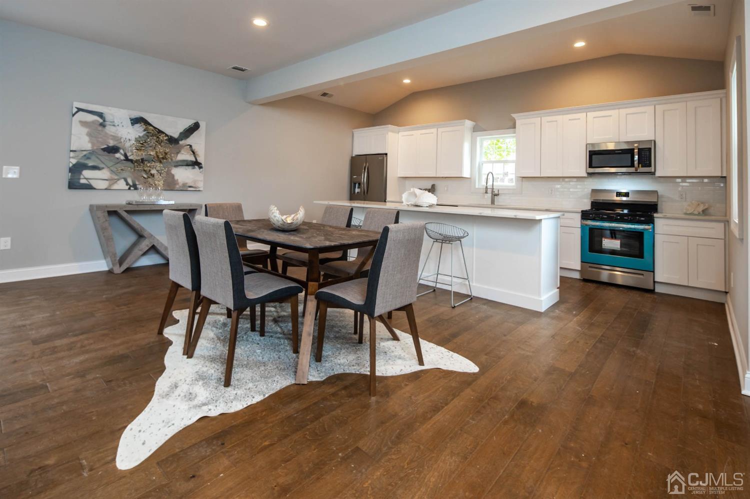 84 Ashley Road Edison, NJ 08817 - Photo 8 of 27 a open kitchen with stainless steel appliances granite countertop a stove a sink a microwave and a refrigerator
