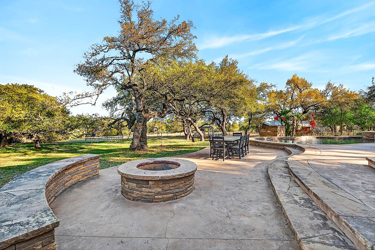 301 Medlin Creek Loop Dripping Springs, TX 78620 - Photo 31 of 40 View of patio featuring an outdoor fire pit and outdoor dining area