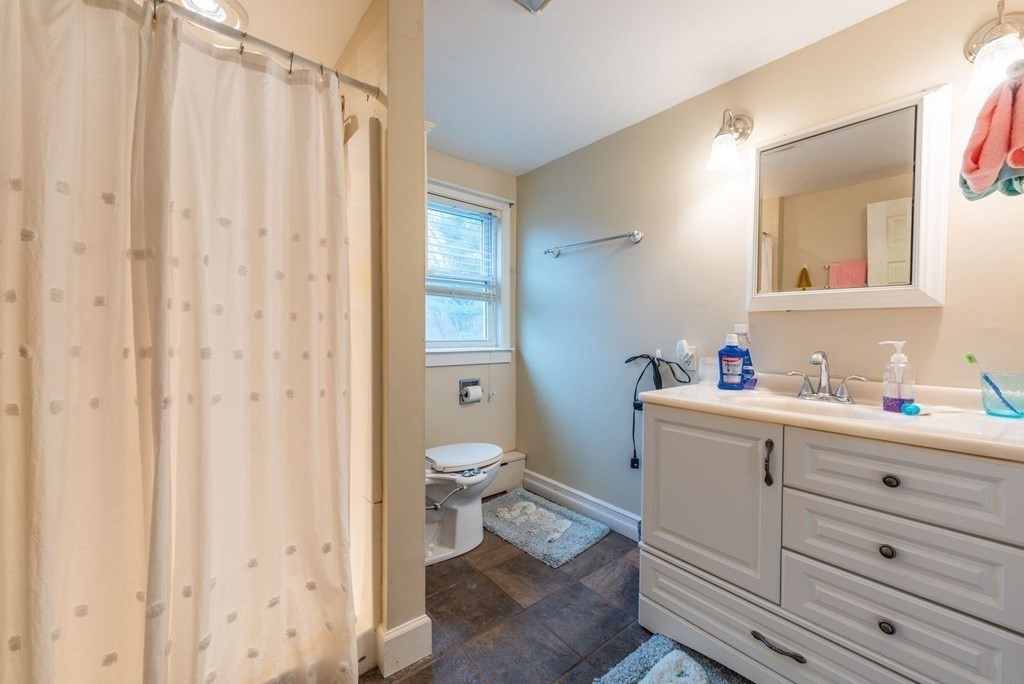 320 Pelham Road Amherst, MA 01002 - Photo 21 of 23 a bathroom with a sink a toilet and shower