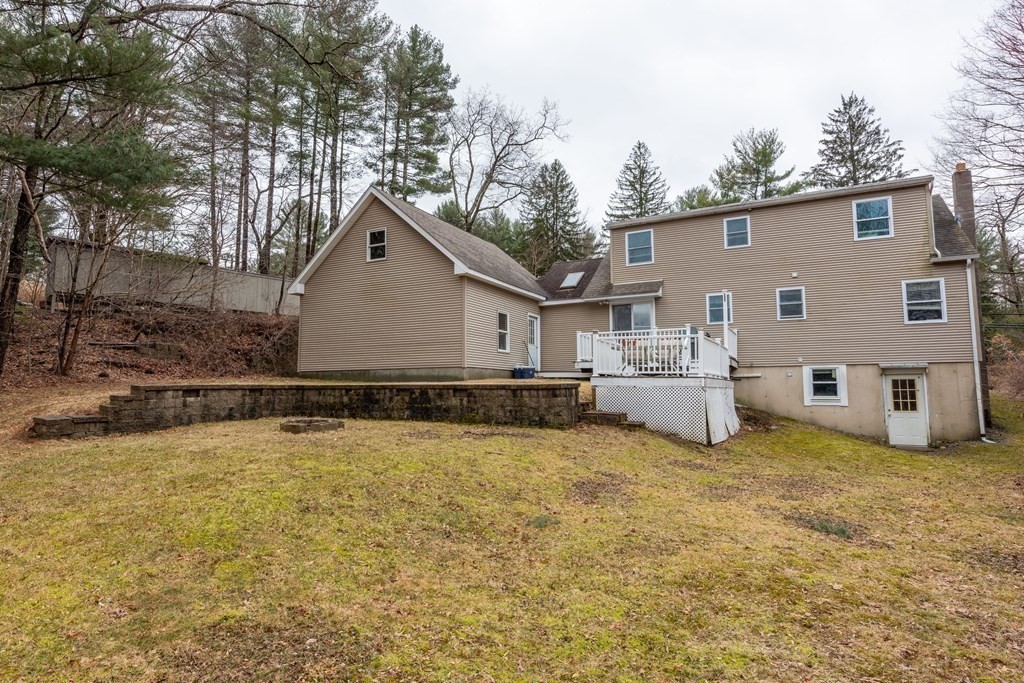 320 Pelham Road Amherst, MA 01002 - Photo 7 of 23 a view of a white house with a yard covered in the middle