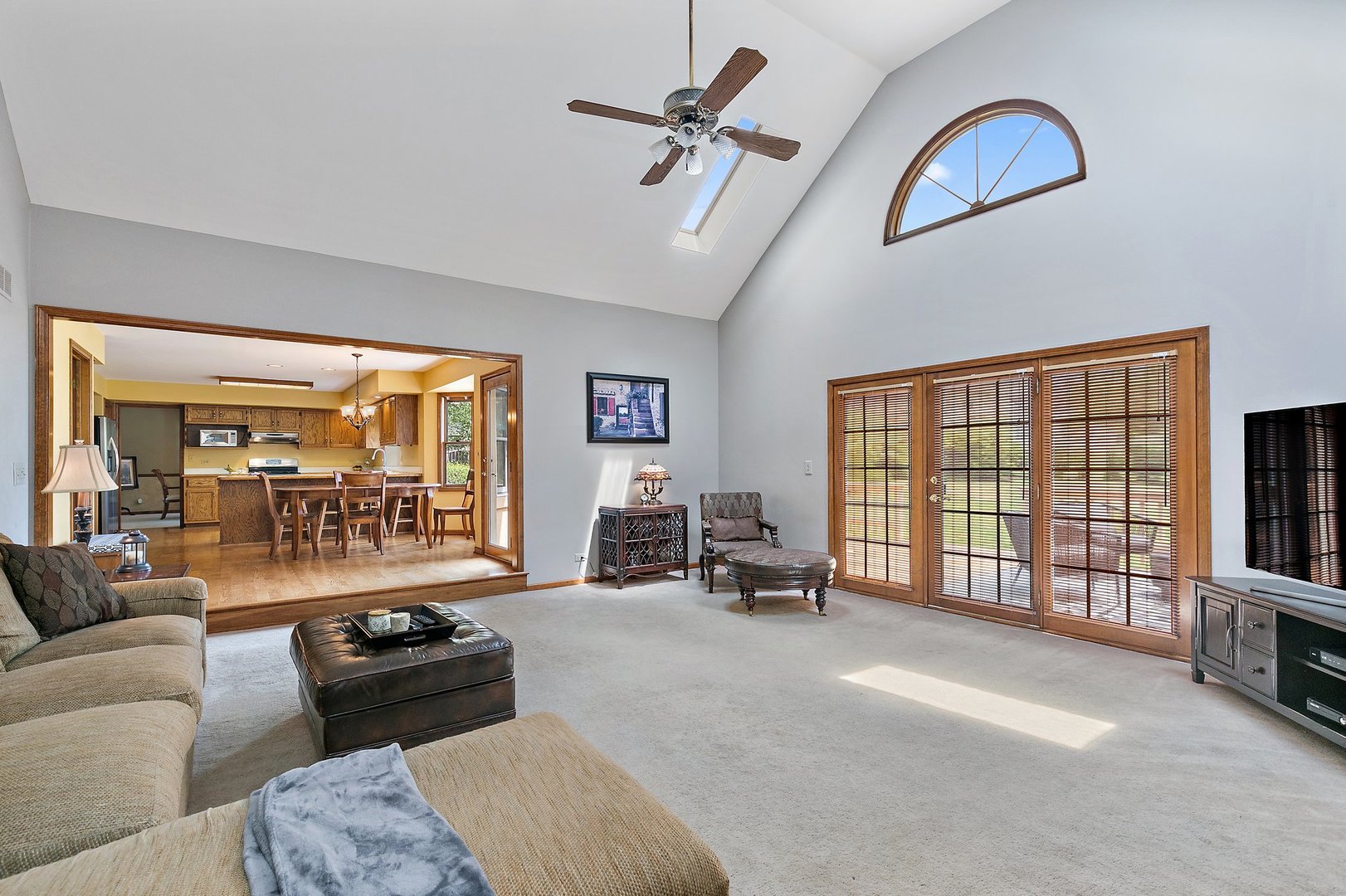 655 Red Maple Lane Roselle, IL 60172 - Photo 11 of 40 a living room with furniture and a flat screen tv