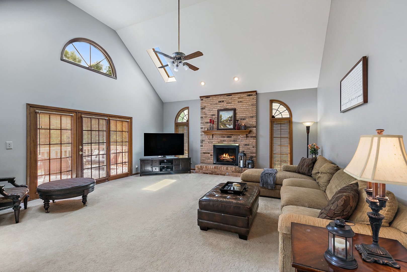 655 Red Maple Lane Roselle, IL 60172 - Photo 12 of 40 a living room with furniture gym equipment and a flat screen tv
