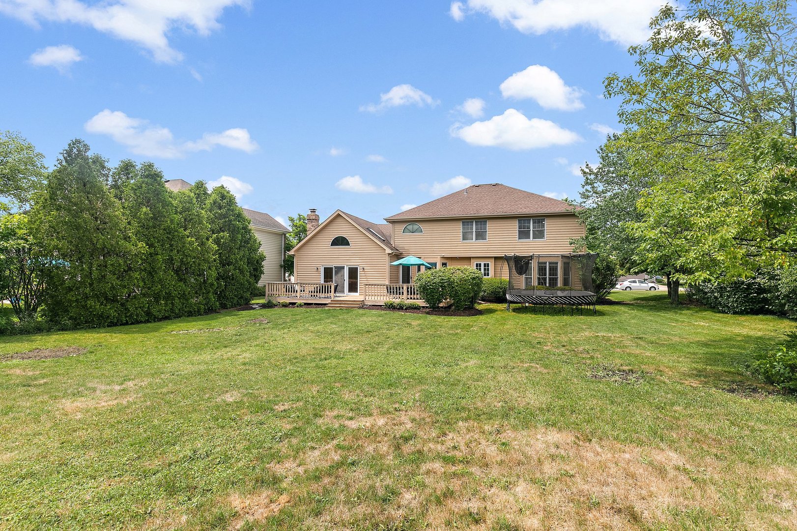 655 Red Maple Lane Roselle, IL 60172 - Photo 31 of 40 a view of a house with a yard