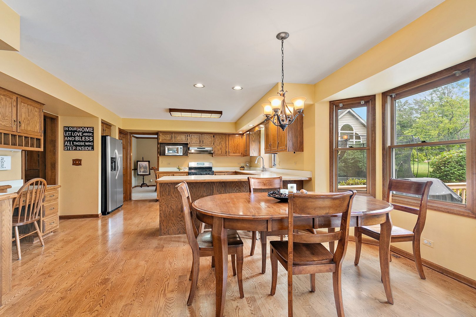 655 Red Maple Lane Roselle, IL 60172 - Photo 9 of 40 a dining room with furniture window wooden floor
