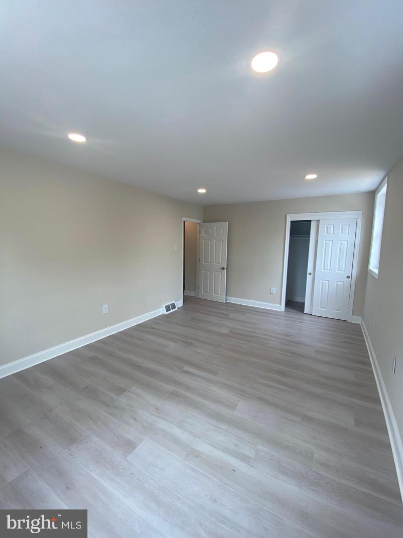 1207 County Line Road Bryn Mawr, PA 19010 - Photo 12 of 17 a view of an empty room with wooden floor and closet