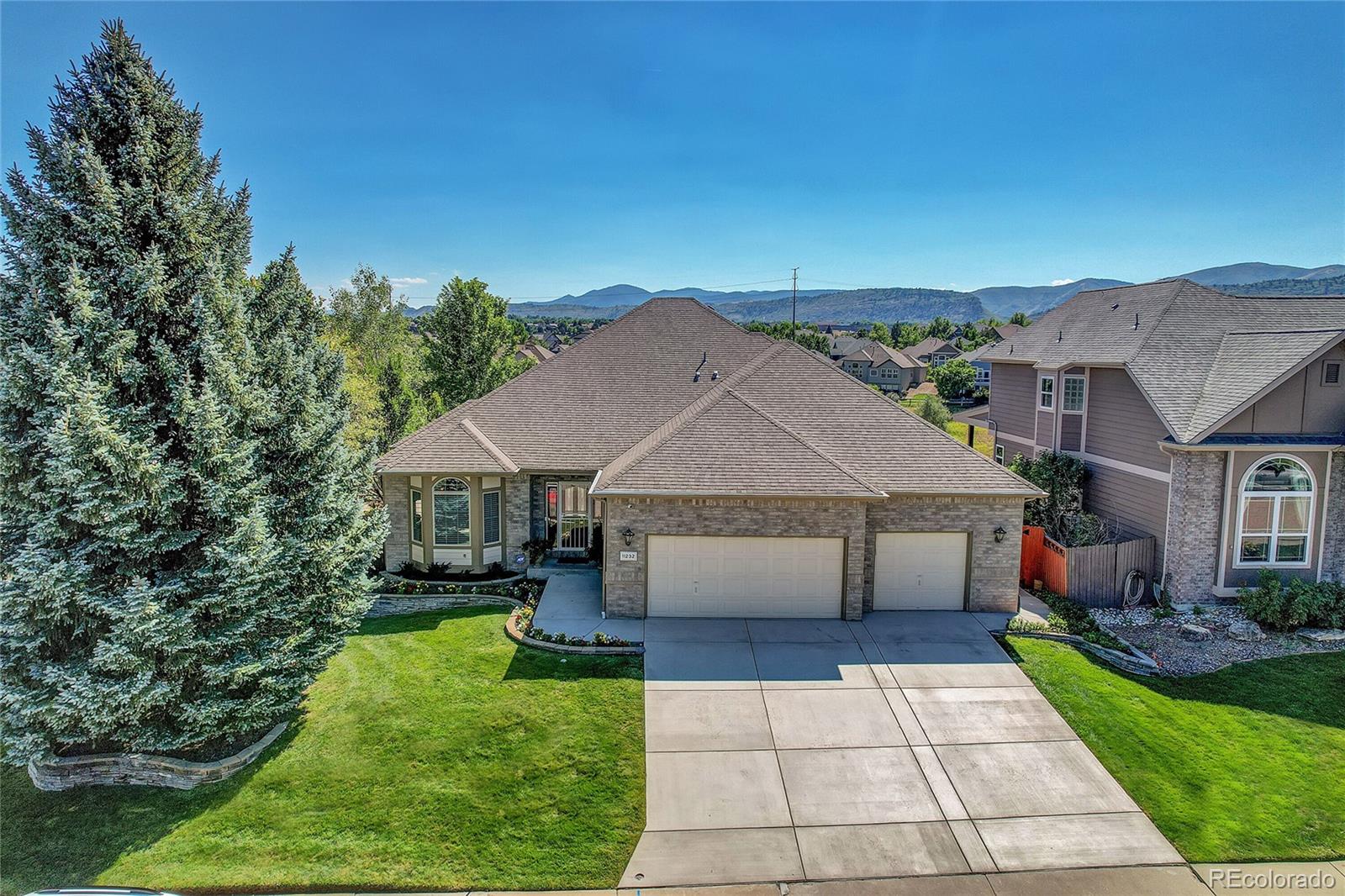 11232 West Cooper Drive Littleton, CO 80127 - Photo 3 of 48 a house view with a garden space