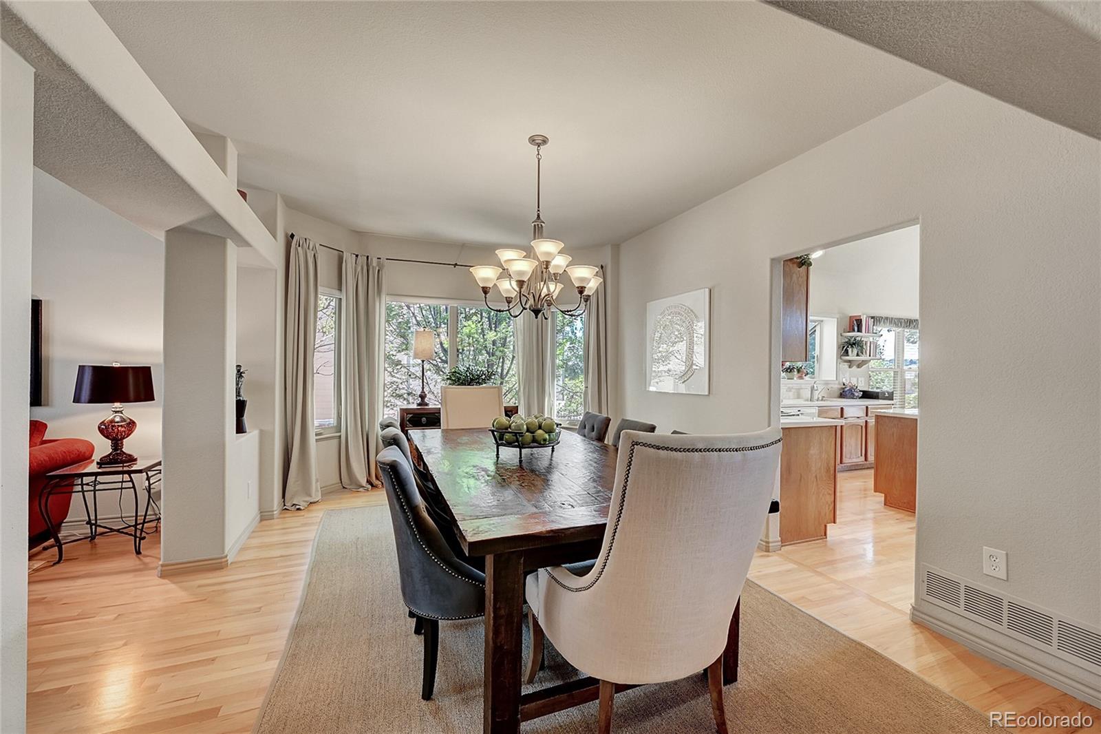 11232 West Cooper Drive Littleton, CO 80127 - Photo 9 of 48 a view of a dining room with furniture and window
