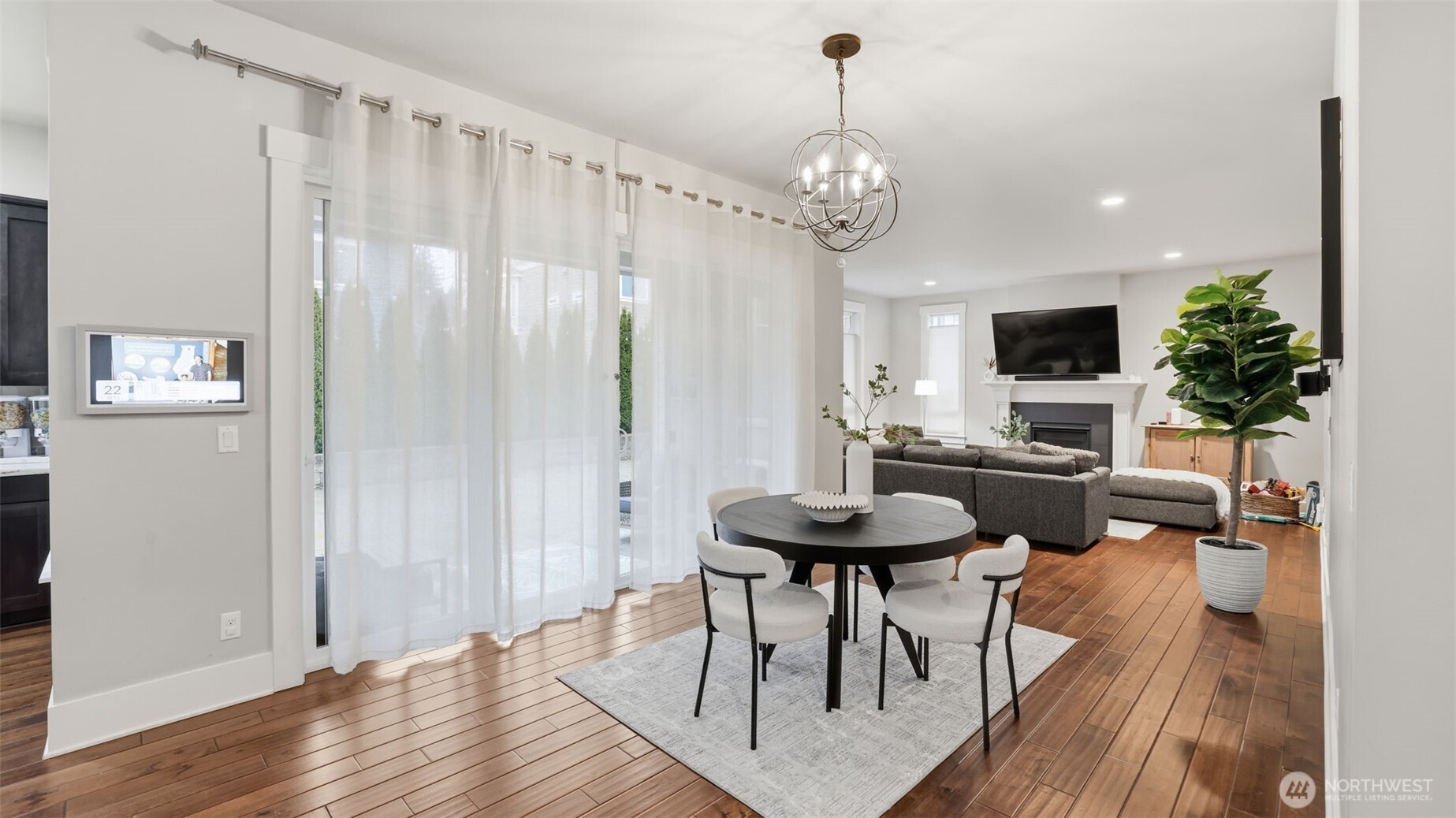 6508 Southeast 7th Place Renton, WA 98059 - Photo 13 of 32 a view of a dining room with furniture wooden floor and chandelier