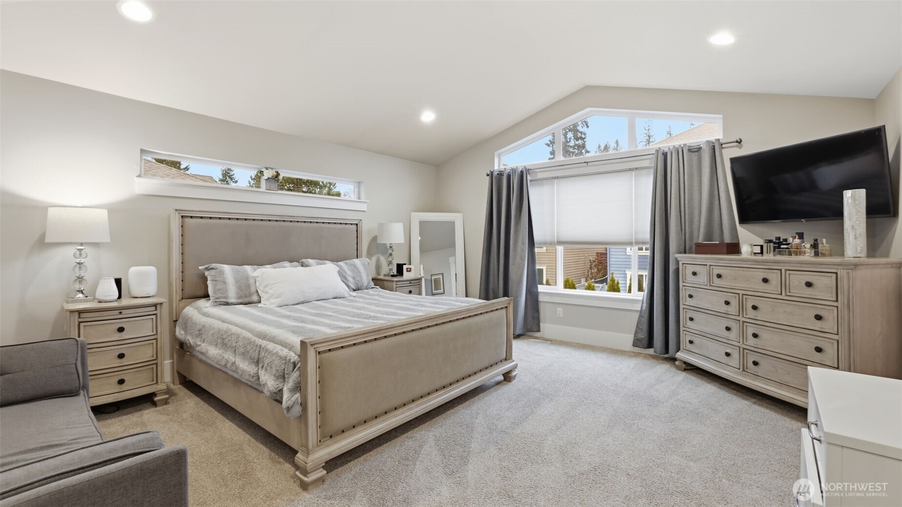 6508 Southeast 7th Place Renton, WA 98059 - Photo 21 of 32 a spacious bedroom with a bed and a television in it