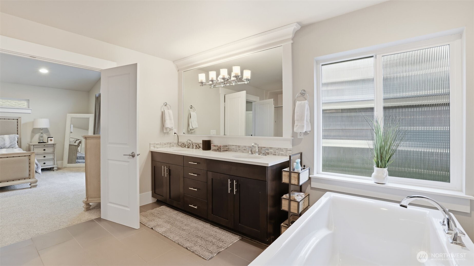 6508 Southeast 7th Place Renton, WA 98059 - Photo 24 of 32 a spacious bathroom with a tub sink and mirror