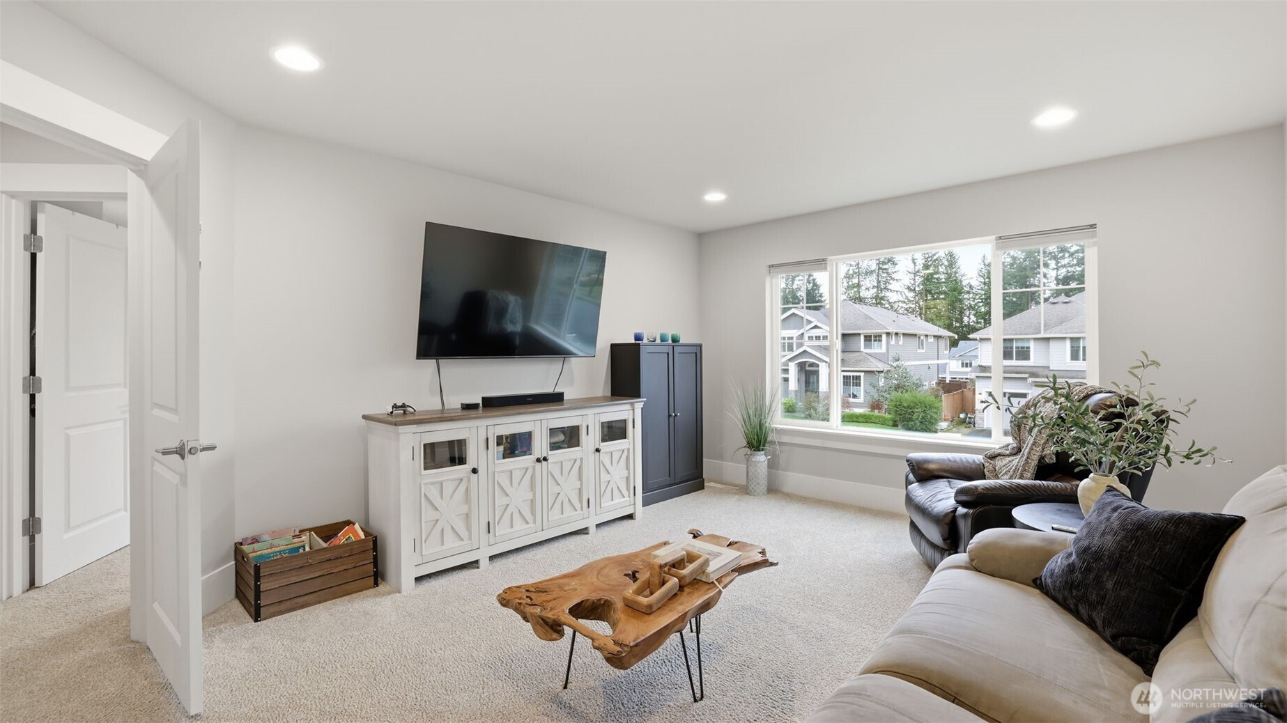 6508 Southeast 7th Place Renton, WA 98059 - Photo 29 of 32 a living room with furniture and a flat screen tv