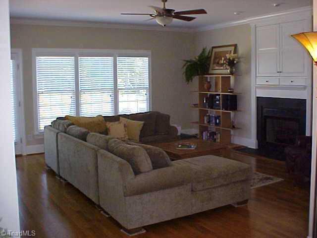 5705 Cape Fox Drive Oak Ridge, NC 27310 - Photo 3 of 8 Other. Den with Gas Log Fireplace and T.V. Cabinet.