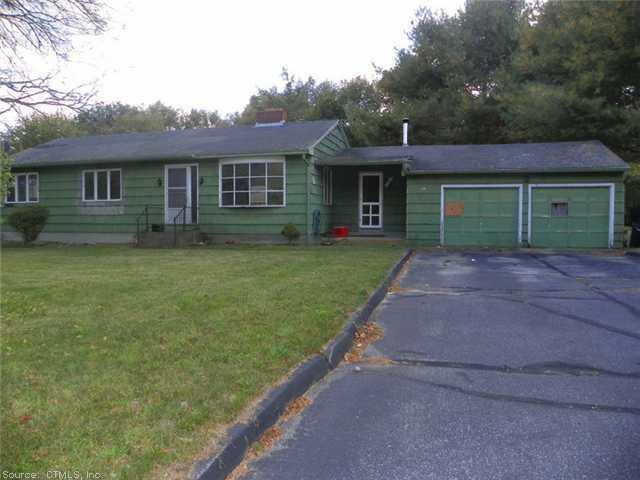 29 Toper Road Plainfield, CT 06374 - Photo 1 of 1 a front view of a house with a garden