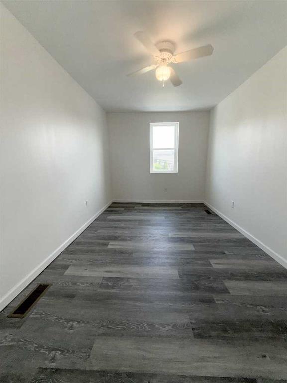 437 Sapphire Way Pittsburgh, PA 15224 - Photo 17 of 20 an empty room with wooden floor and windows