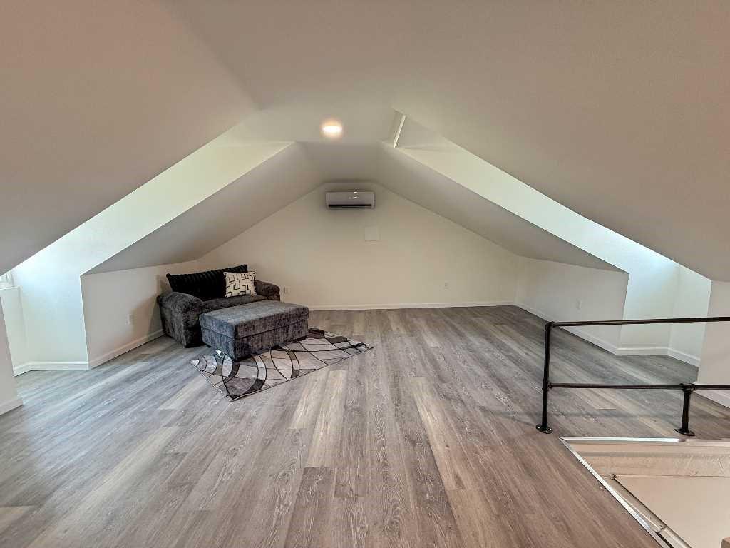 437 Sapphire Way Pittsburgh, PA 15224 - Photo 18 of 20 a living room with wooden floor and furniture