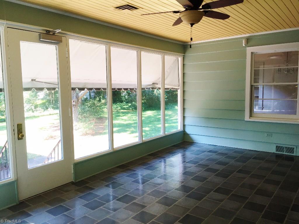 3030 University Road Winston-Salem, NC 27104 - Photo 12 of 15 Big sunroom overlooks backyard and has nice awnings