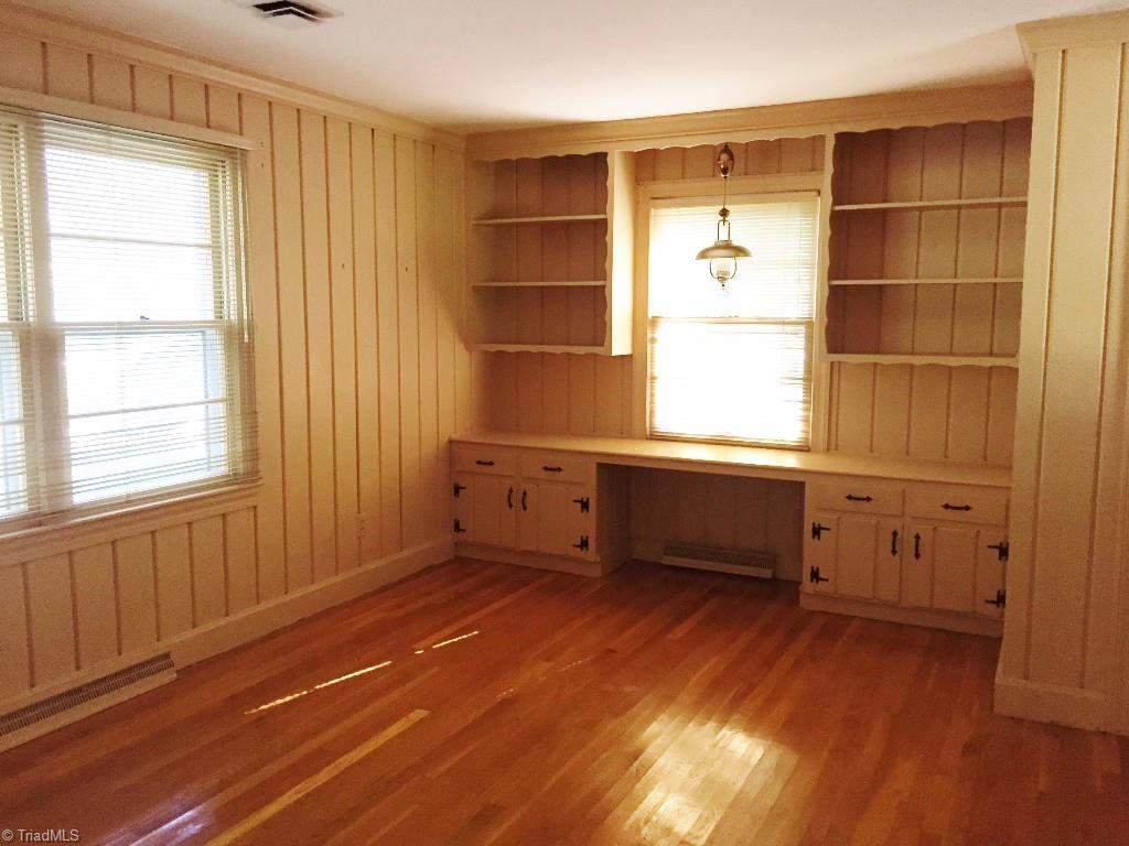 3030 University Road Winston-Salem, NC 27104 - Photo 8 of 15 Big den with built-in desk and shelving. Half bath is next to this den.