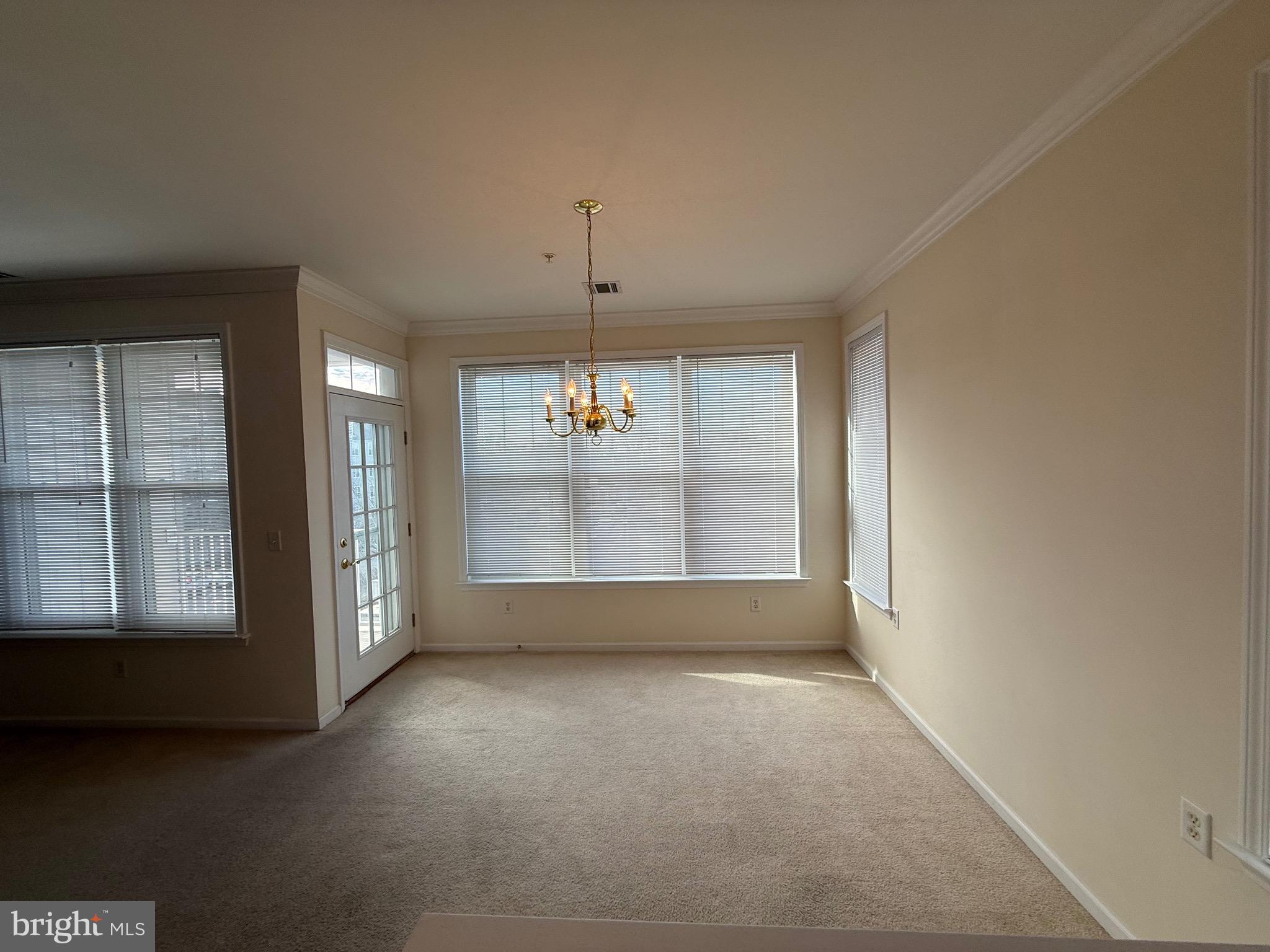 231 Masterson Court Ewing, NJ 08618 - Photo 12 of 43 an empty room with windows and entrance