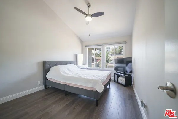 a bed room with a bed and a chair