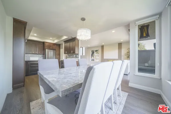 a view of a kitchen and dining room