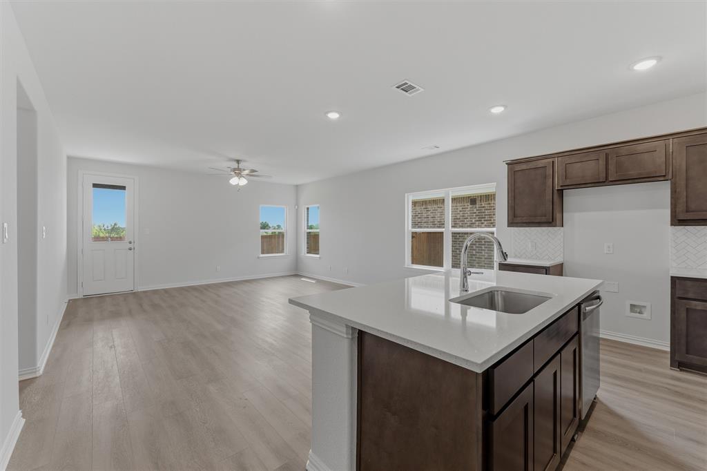 3504 Helena Street Gainesville, TX 76240 - Photo 7 of 19 Open-concept living space featuring wood-finish flooring, recessed lighting, and a ceiling fan