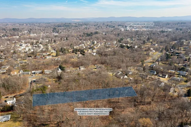 an aerial view of house with yard