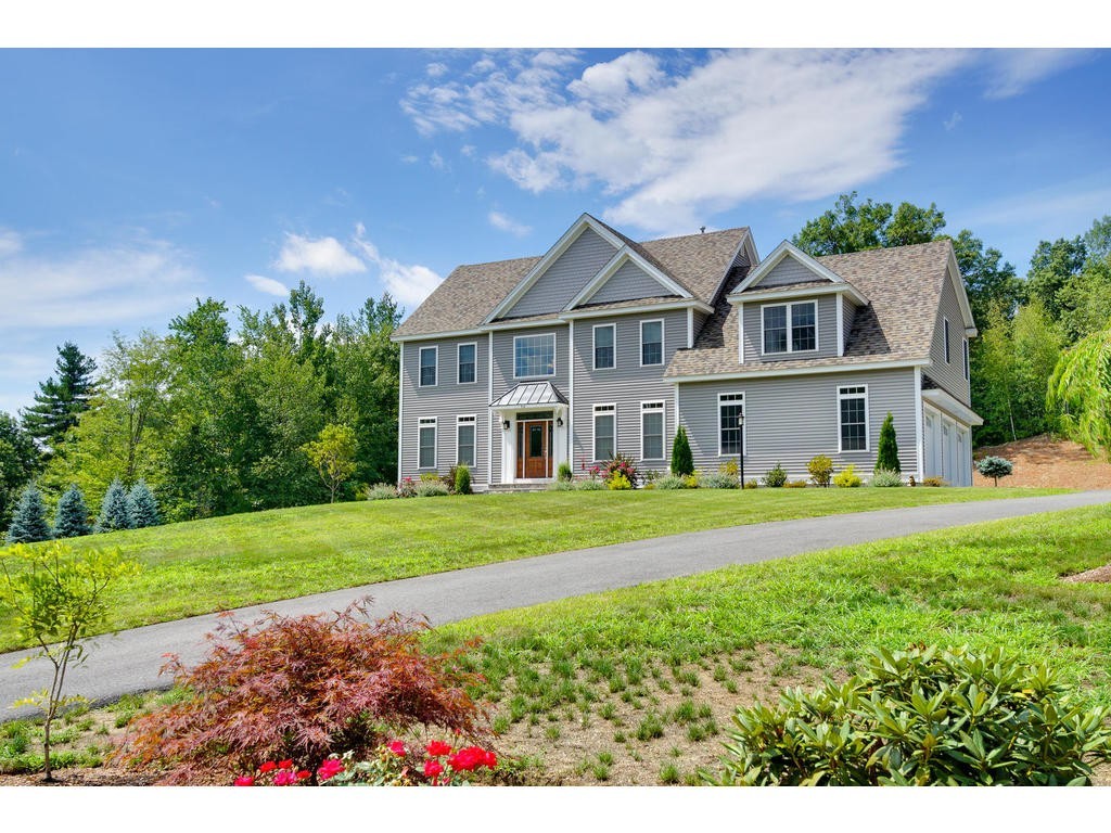 50 Fox Run Road Bolton, MA 01740 - Photo 1 of 20 a front view of a house with a yard and garage