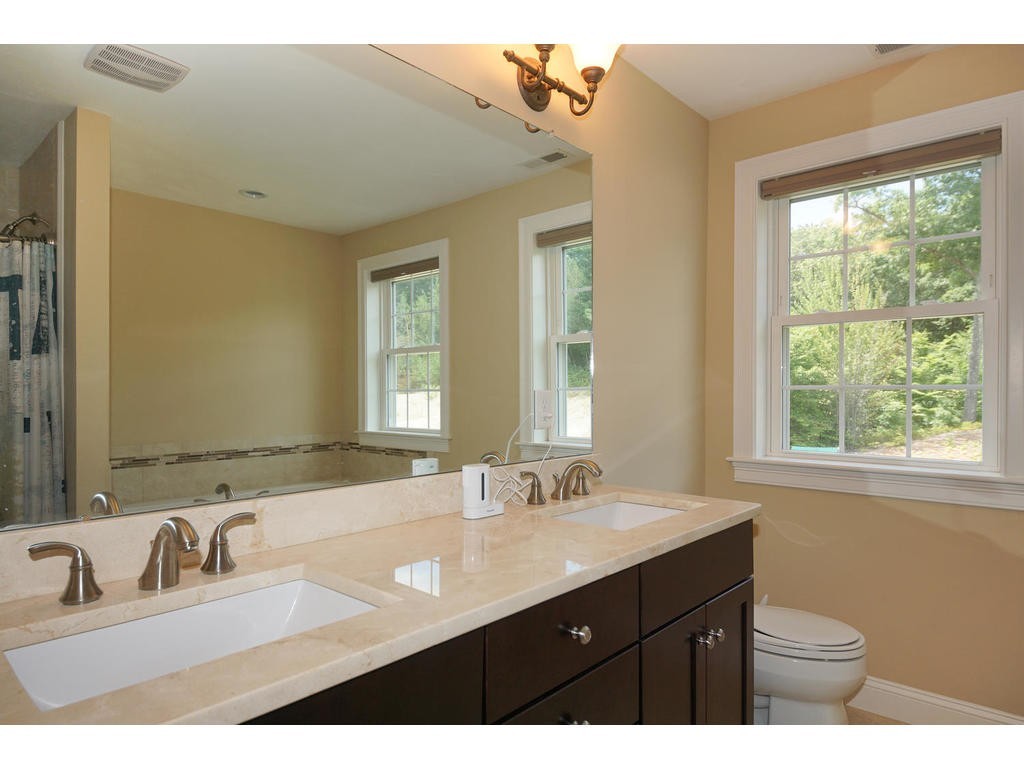 50 Fox Run Road Bolton, MA 01740 - Photo 11 of 20 a bathroom with a sink double vanity and a mirror