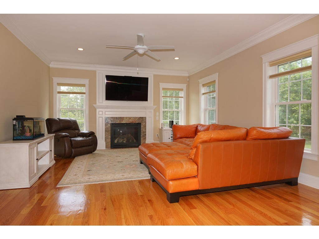 50 Fox Run Road Bolton, MA 01740 - Photo 4 of 20 a living room with furniture and a flat screen tv